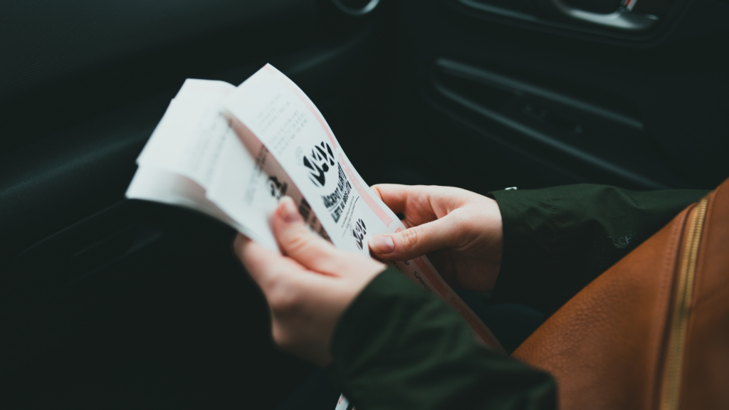 a person holding a ticket