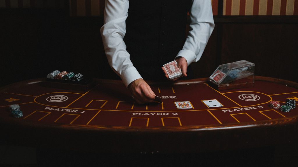 a person holding a casino cards