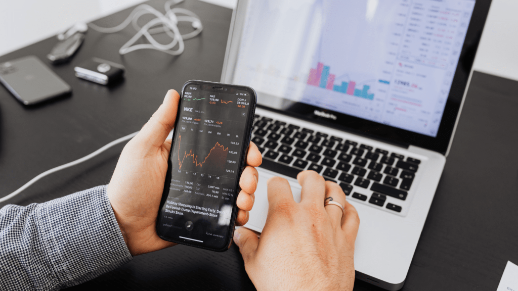 a person using their smartphone to check the stock market