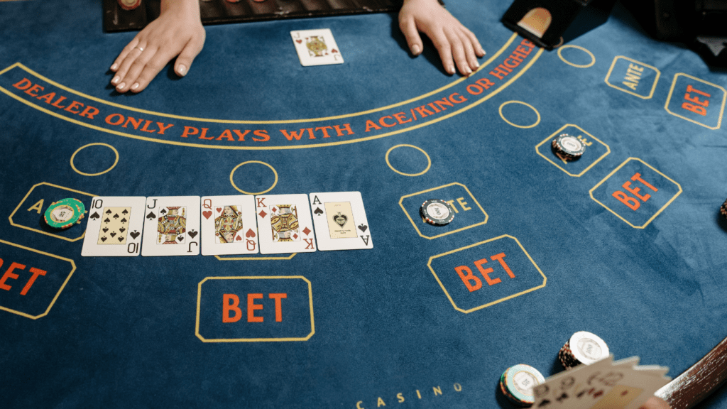 a casino table with several cards and chips on it