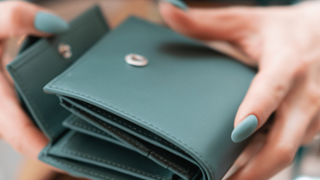 a person holding a wallet